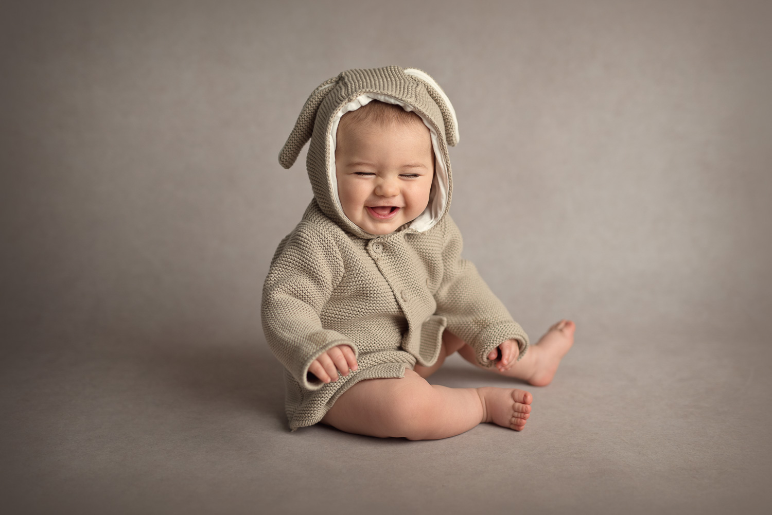 cute baby laughing in rabbit outfit by siobhan kelly photography