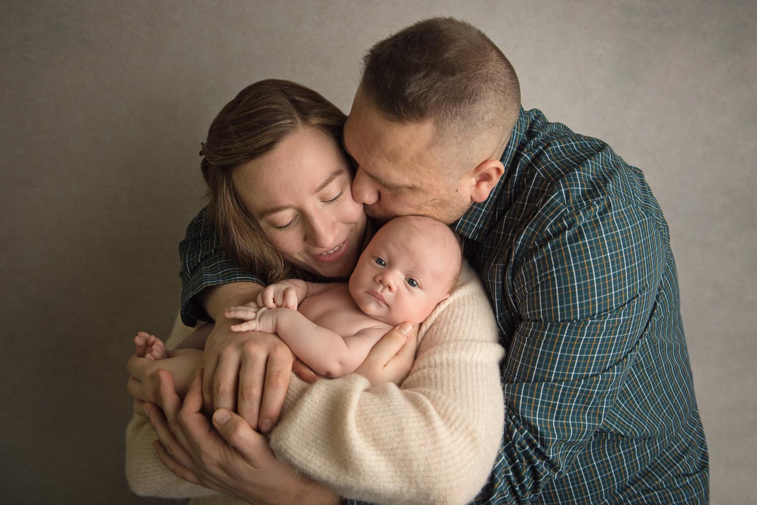 baby sleeping with parents by newborn photographer siobhan kelly