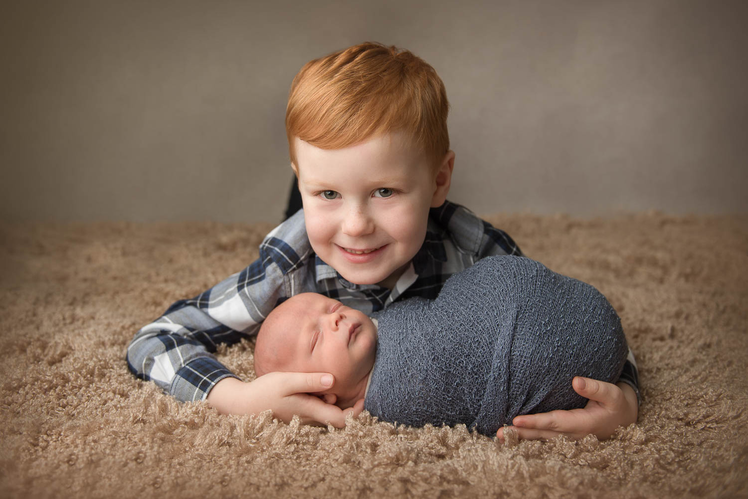 newborn and sibling photograph