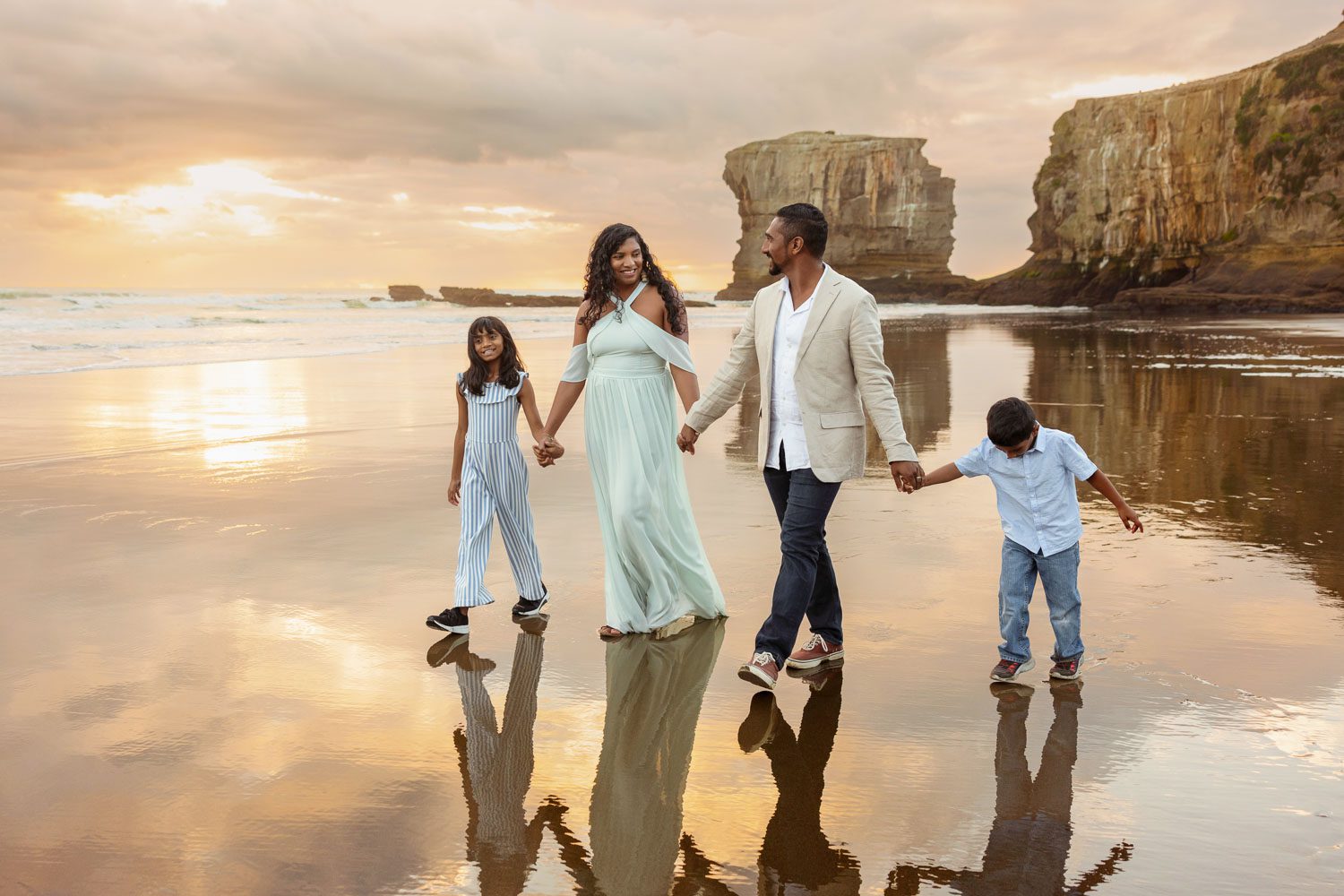 family on beach by family photographer siobhan kelly photography