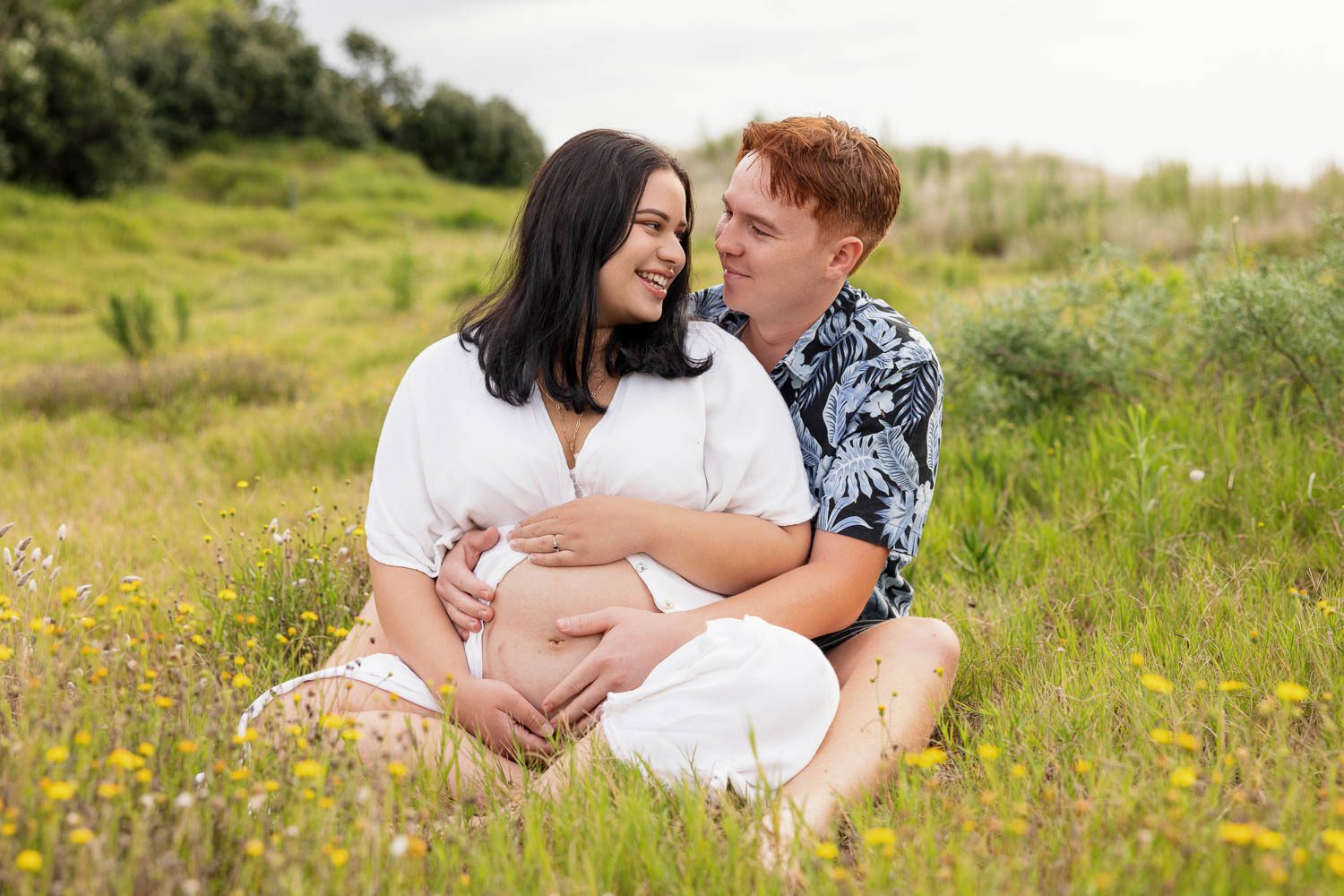 family in grass by family photographer siobhan kelly